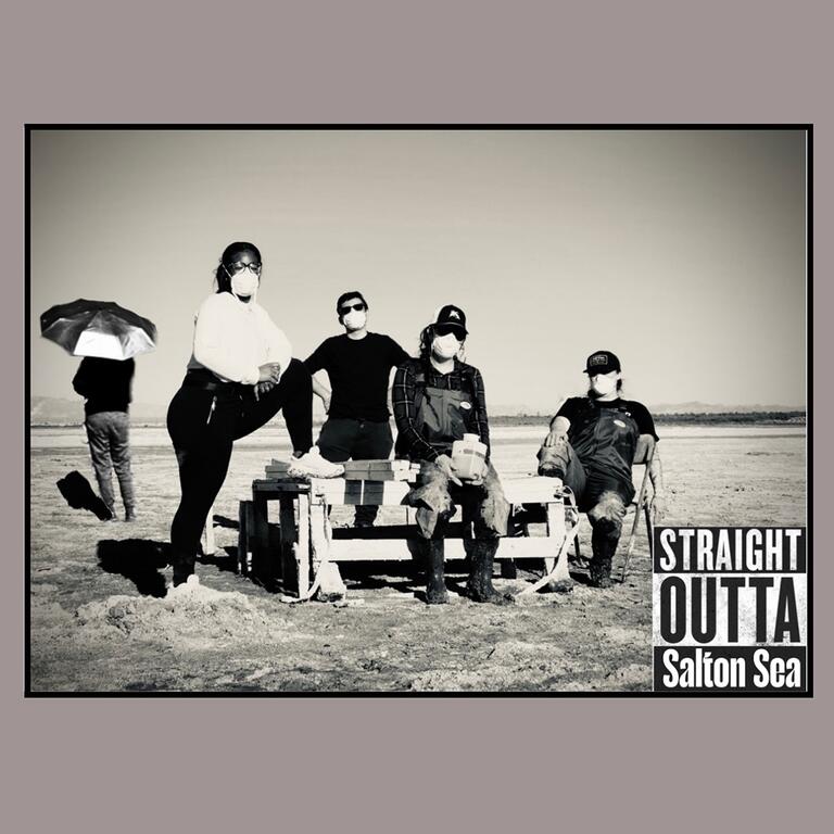 researchers on the salton sea in the style of a rap album cover.