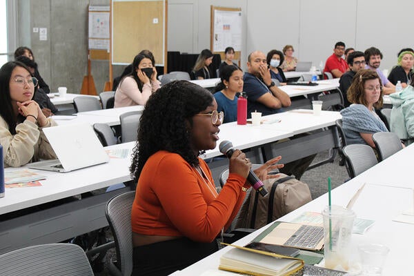 Student speaking at a conference