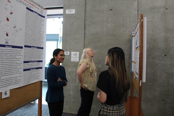 woman reading a poster