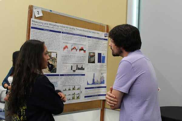 people reading a poster