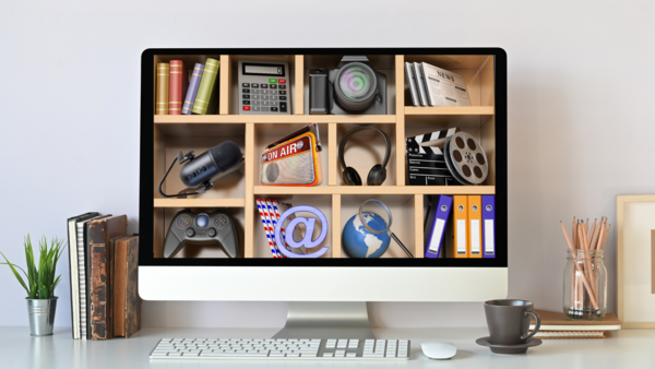 computer desktop with multiple shelves displaying various media outlets (microphone, camera, headphone, etc.)
